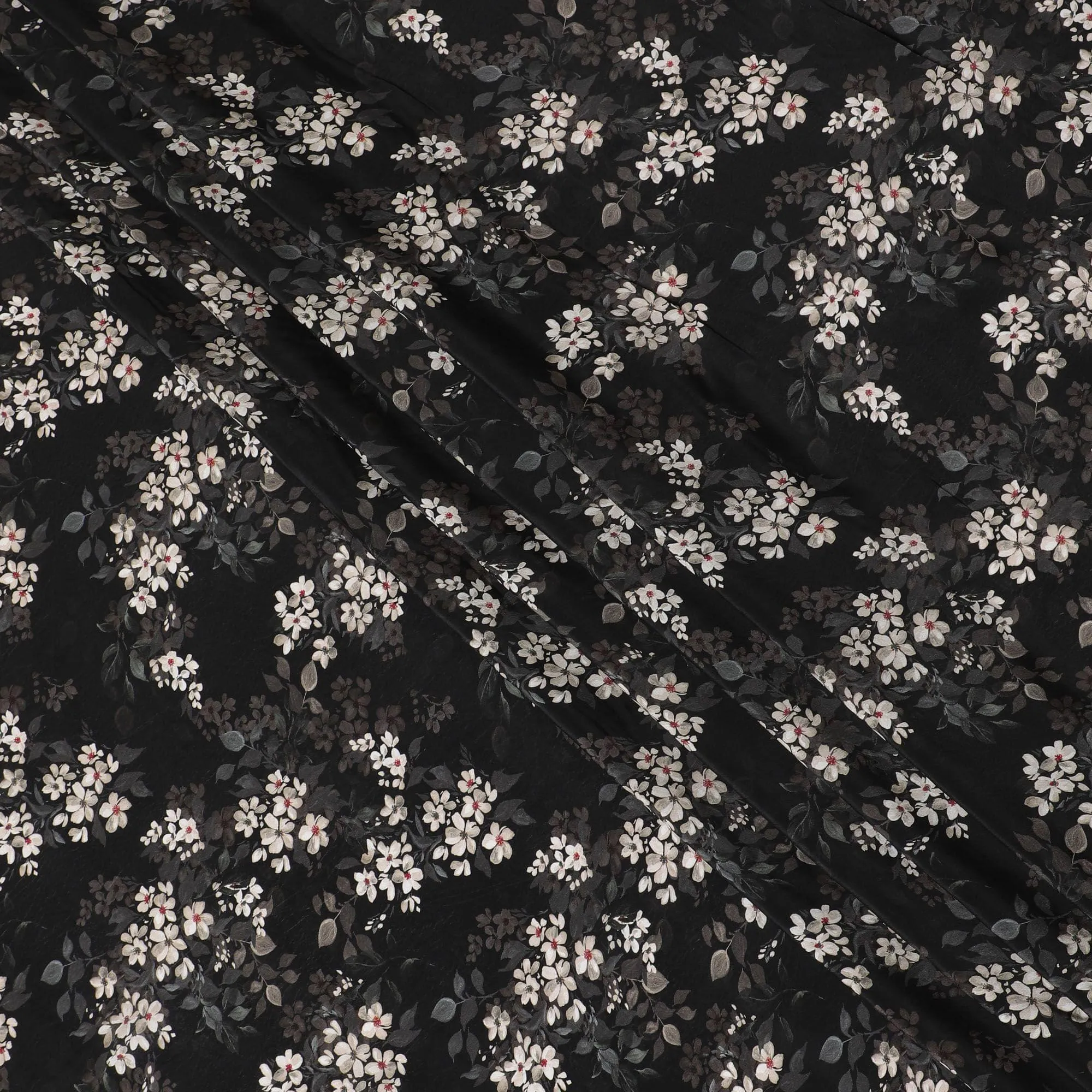 Black synthetic crepe fabric with white, light green and red digital prints in floral design-D15771
