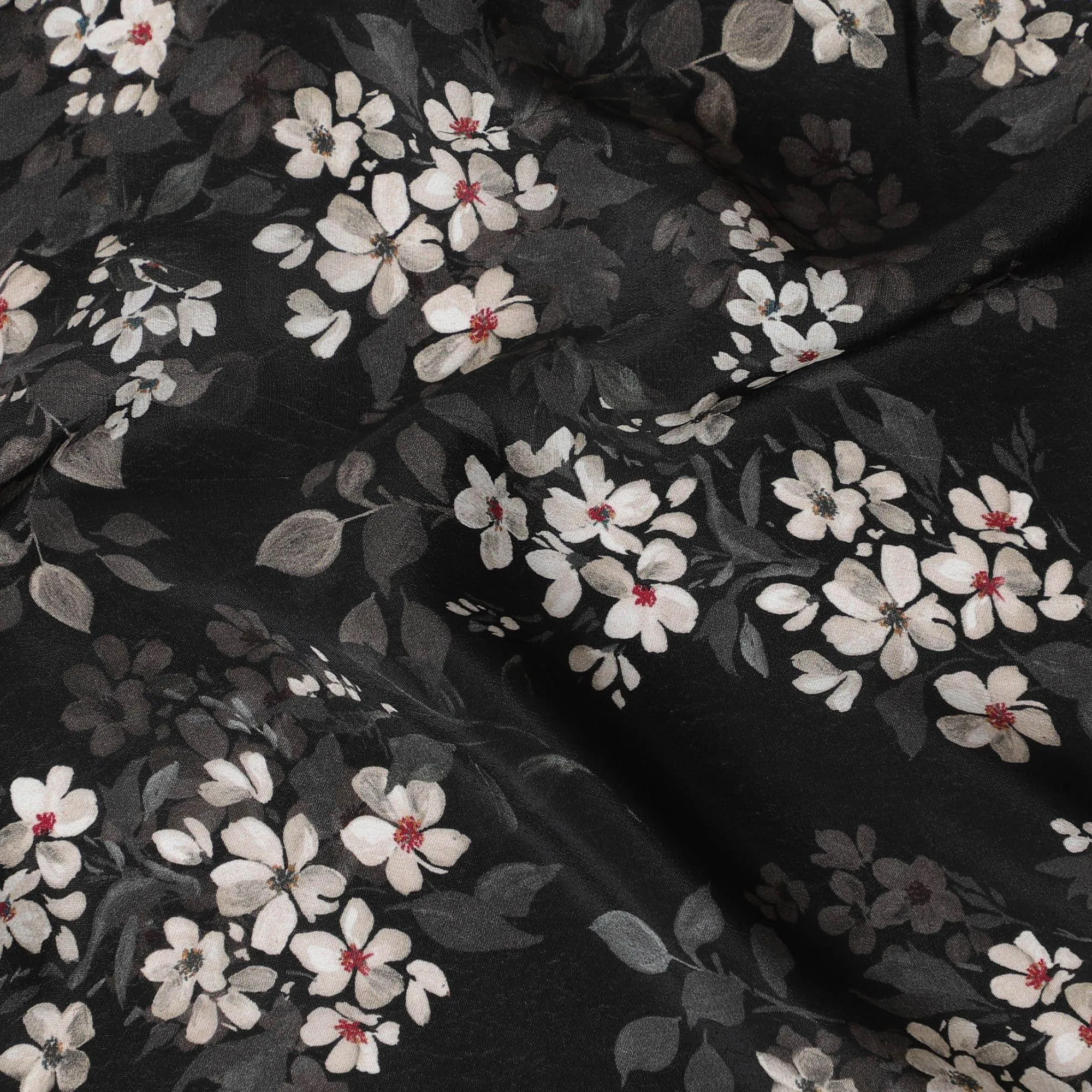 Black synthetic crepe fabric with white, light green and red digital prints in floral design-D15771